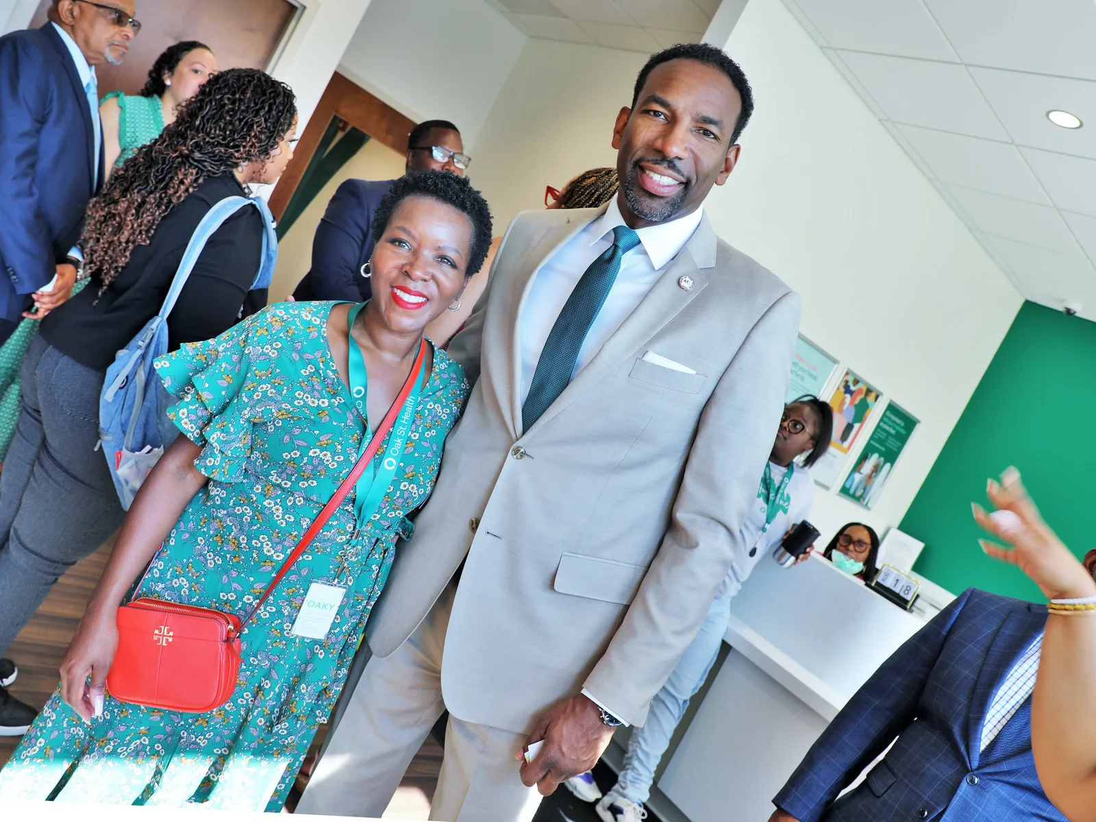 Shawn Caprice Houston smiling with community members at an Oak Street Health gathering